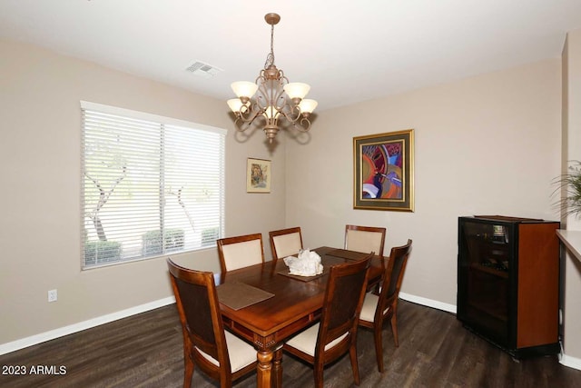 dining room with visible vents, baseboards, and dark wood-type flooring