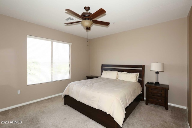 bedroom with baseboards, carpet floors, and visible vents