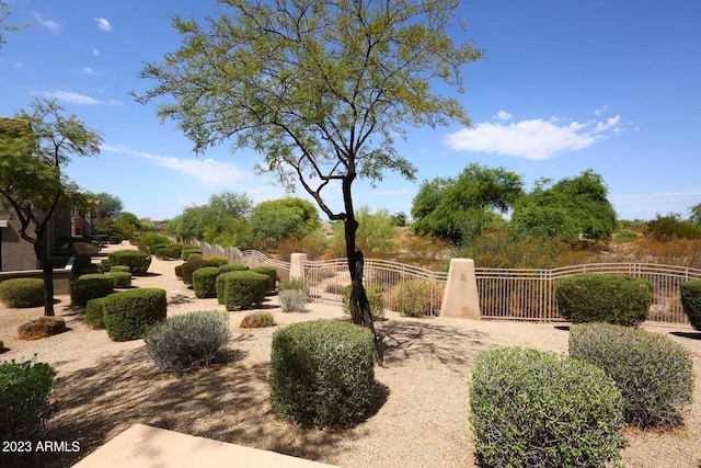 view of community featuring a gate and fence