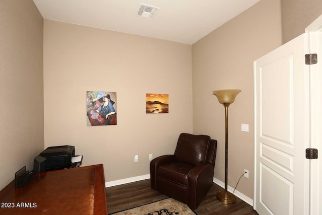 office with visible vents, baseboards, and wood finished floors