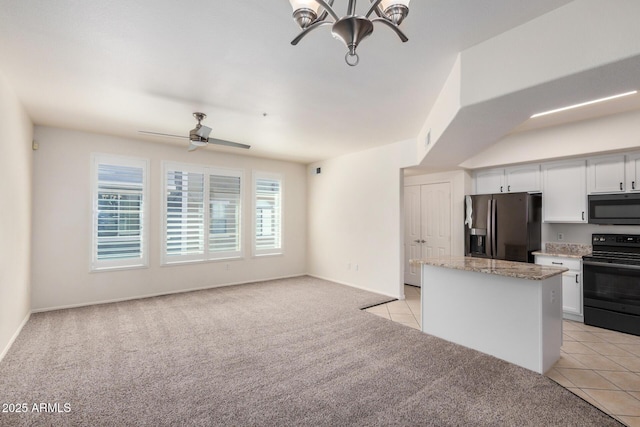 2401 E Rio Salado Pkwy Unit 1048, Tempe, AZ 85288 - kitchen with fridge with ice dispenser, black electric range oven, light colored carpet, white cabinets, and light tile patterned flooring