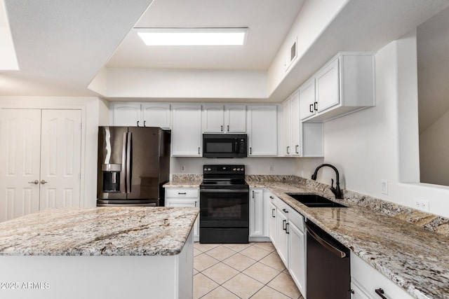 2401 E Rio Salado Pkwy Unit 1048, Tempe, AZ 85288 - kitchen with black appliances, light tile patterned floors, and white cabinets