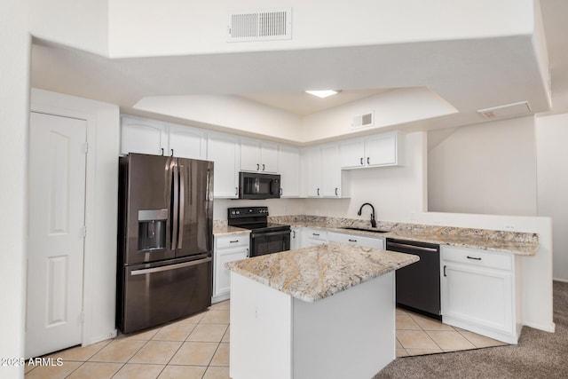 2401 E Rio Salado Pkwy Unit 1048, Tempe, AZ 85288 - kitchen with black appliances, a raised ceiling, light tile patterned floors, white cabinetry, and a peninsula