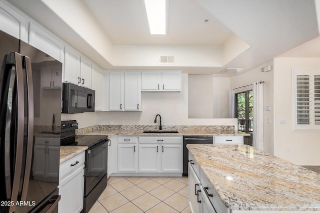 2401 E Rio Salado Pkwy Unit 1048, Tempe, AZ 85288 - kitchen with black appliances, white cabinets, and light tile patterned flooring