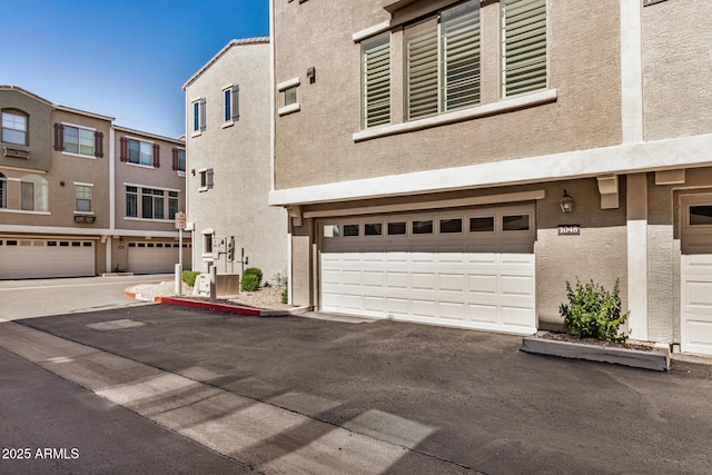 2401 E Rio Salado Pkwy Unit 1048, Tempe, AZ 85288 - view of front of property with stucco siding and an attached garage