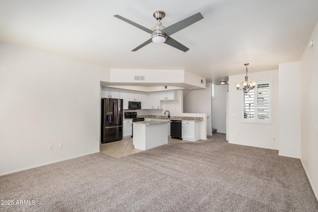 2401 E Rio Salado Pkwy Unit 1048, Tempe, AZ 85288 - kitchen featuring black appliances, open floor plan, a chandelier, and light carpet