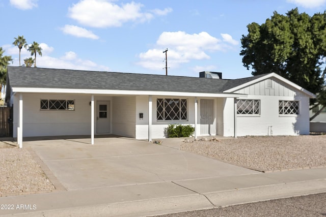 single story home featuring a carport