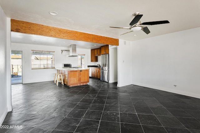 kitchen with island range hood, stainless steel appliances, a breakfast bar, a kitchen island, and ceiling fan