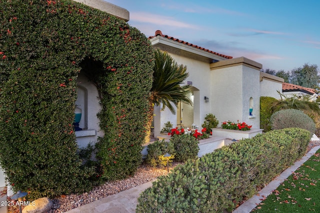 view of property exterior at dusk