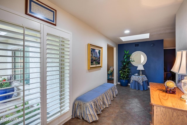 interior space featuring a skylight