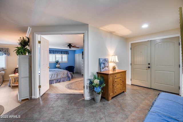 entryway featuring ceiling fan