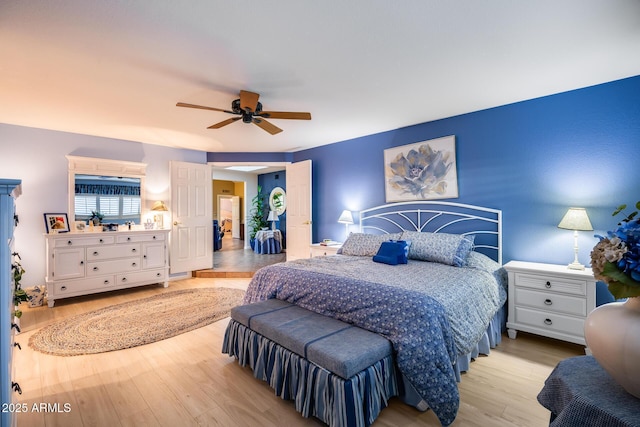 bedroom featuring ceiling fan and light hardwood / wood-style flooring