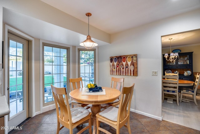 dining space featuring a notable chandelier