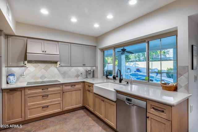 kitchen featuring dishwasher, sink, decorative backsplash, light tile patterned floors, and black electric cooktop