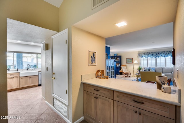 bathroom with tile patterned flooring and sink