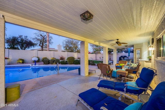 view of pool with a patio and ceiling fan