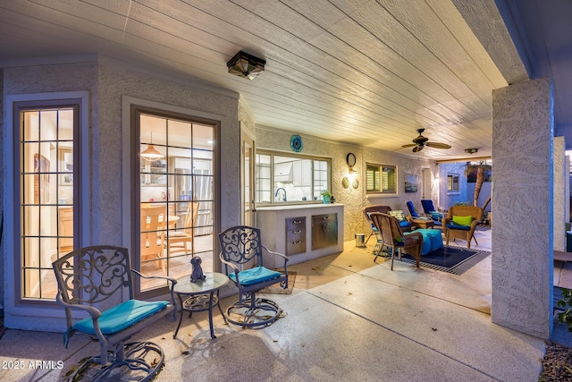 view of patio featuring sink and ceiling fan