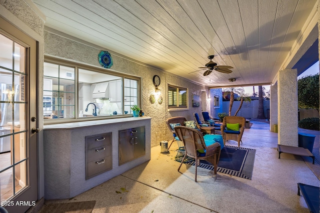 view of patio with ceiling fan