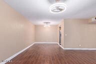 basement featuring dark hardwood / wood-style floors