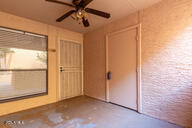 spare room featuring concrete floors and ceiling fan