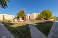 view of property's community with a yard