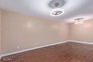 basement featuring wood-type flooring