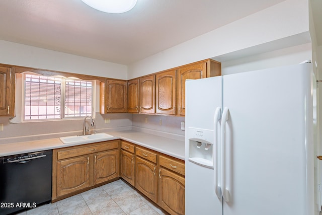 10335 W Mission Ln, Sun City, AZ 85351 - kitchen featuring brown cabinetry, a sink, light countertops, white refrigerator with ice dispenser, and black dishwasher