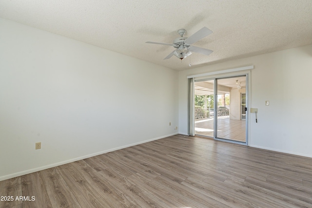 10335 W Mission Ln, Sun City, AZ 85351 - spare room featuring baseboards, wood finished floors, a textured ceiling, and ceiling fan