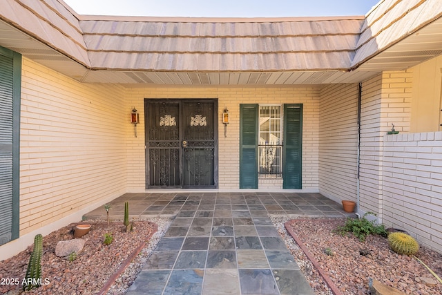 10335 W Mission Ln, Sun City, AZ 85351 - entrance to property featuring mansard roof and brick siding