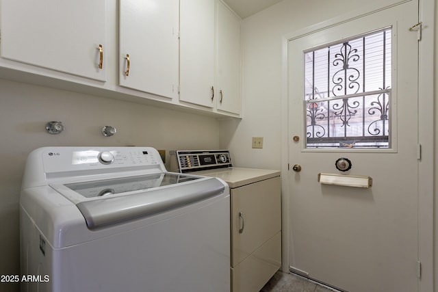 10335 W Mission Ln, Sun City, AZ 85351 - laundry area featuring cabinet space, a healthy amount of sunlight, and independent washer and dryer