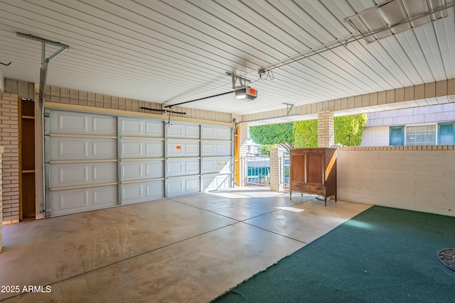 10335 W Mission Ln, Sun City, AZ 85351 - garage with a garage door opener and fence