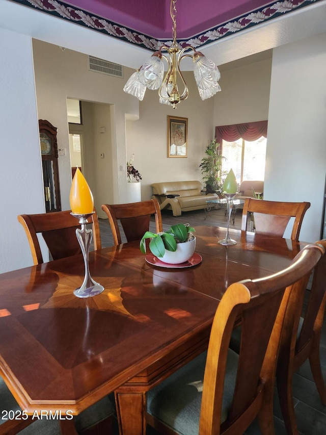 dining room with a notable chandelier