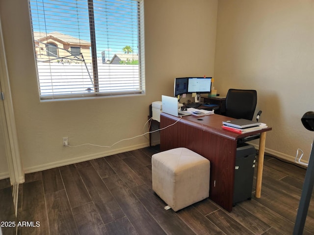 home office with dark hardwood / wood-style flooring