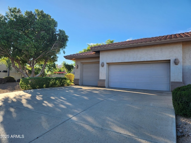 view of side of property with a garage