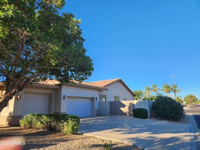 mediterranean / spanish-style home featuring a garage