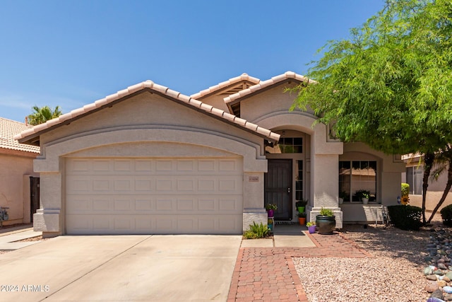 17606 N 2nd Ave, Phoenix, AZ 85023 - view of front of home featuring a garage, driveway, stucco siding, and a tile roof