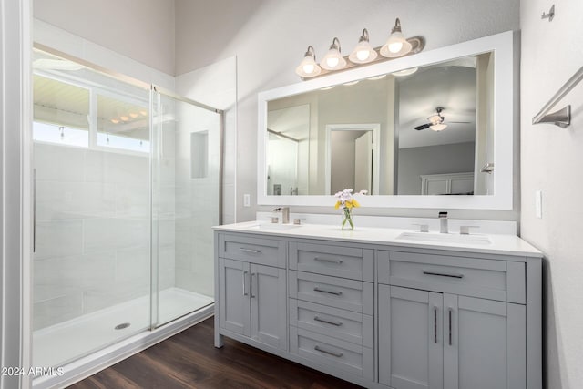 17606 N 2nd Ave, Phoenix, AZ 85023 - bathroom featuring double vanity, a shower stall, wood finished floors, and ceiling fan