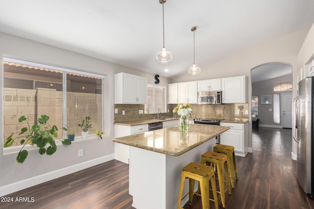 17606 N 2nd Ave, Phoenix, AZ 85023 - kitchen with stainless steel appliances, a sink, arched walkways, decorative backsplash, and white cabinetry