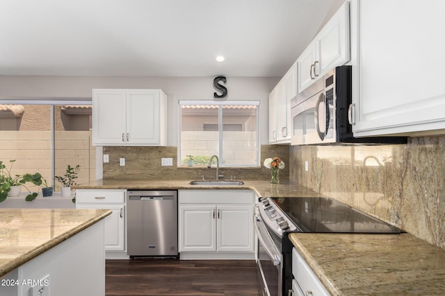 17606 N 2nd Ave, Phoenix, AZ 85023 - kitchen featuring stainless steel appliances, a sink, white cabinetry, dark wood finished floors, and backsplash