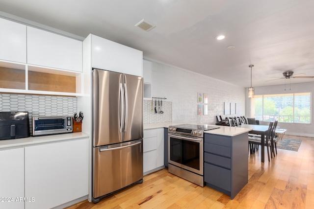 kitchen featuring stainless steel appliances, white cabinetry, backsplash, light hardwood / wood-style flooring, and pendant lighting