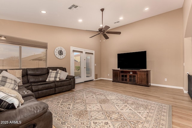 living room featuring recessed lighting, visible vents, baseboards, and wood finished floors