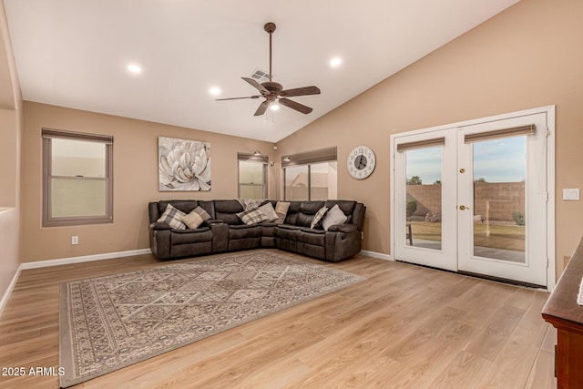 living area featuring a ceiling fan, french doors, baseboards, and wood finished floors