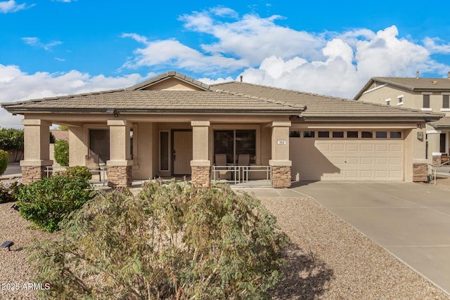 view of front of house featuring an attached garage, covered porch, stone siding, driveway, and stucco siding