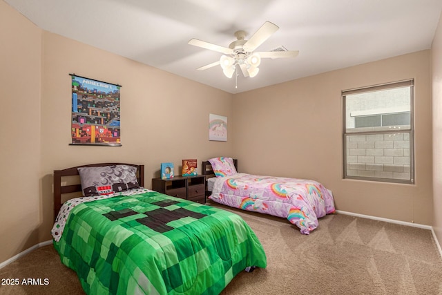 carpeted bedroom with a ceiling fan and baseboards