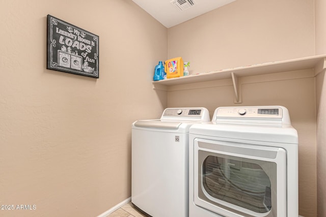 washroom with tile patterned flooring, laundry area, visible vents, baseboards, and independent washer and dryer