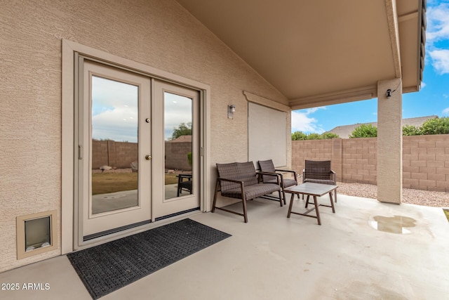 view of patio / terrace with french doors and fence