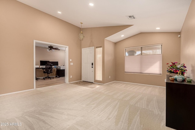 foyer entrance featuring vaulted ceiling, recessed lighting, visible vents, and light colored carpet