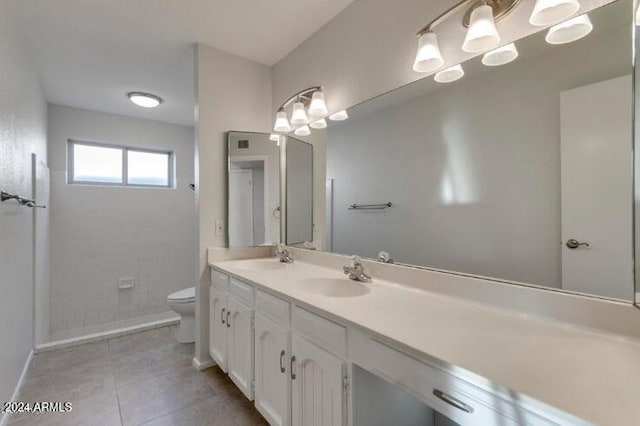 bathroom featuring tile patterned floors, vanity, and toilet