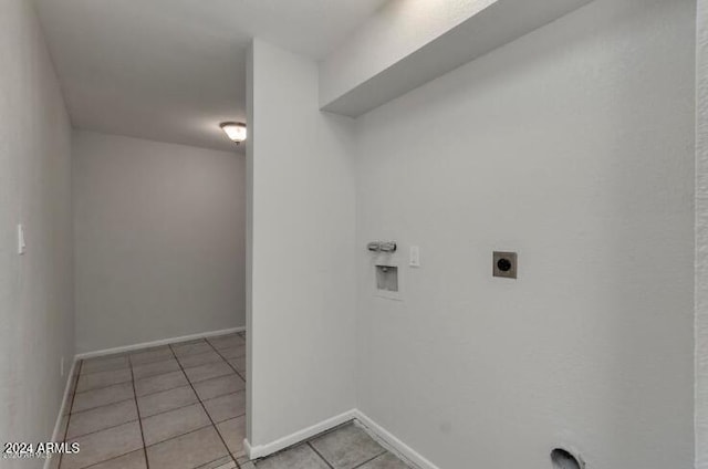 laundry room with hookup for an electric dryer, washer hookup, and light tile patterned floors