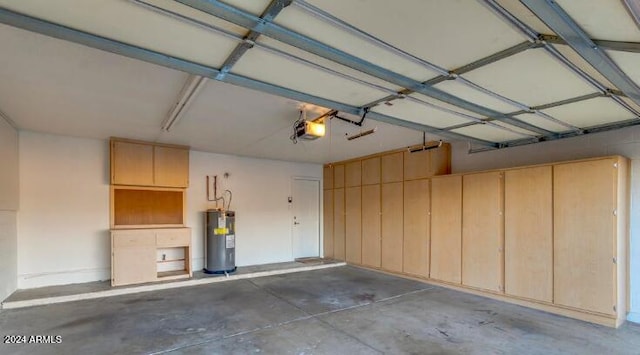 garage with electric water heater and a garage door opener